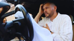 Man experiencing serious injury and chest pain from car accident in Alberta demonstrating need for compensation and legal proof